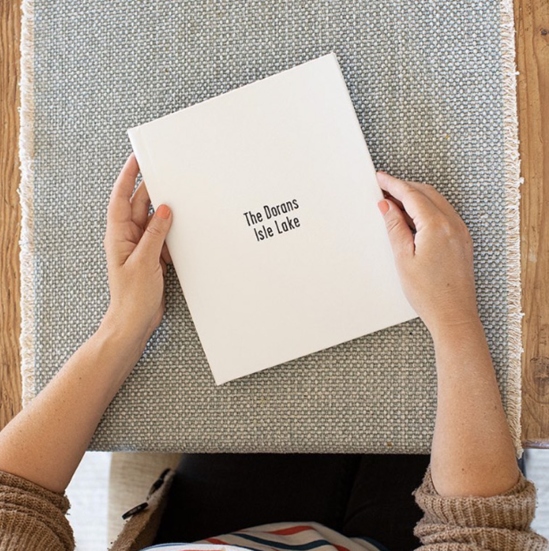 Custom embossed album cover held in hands