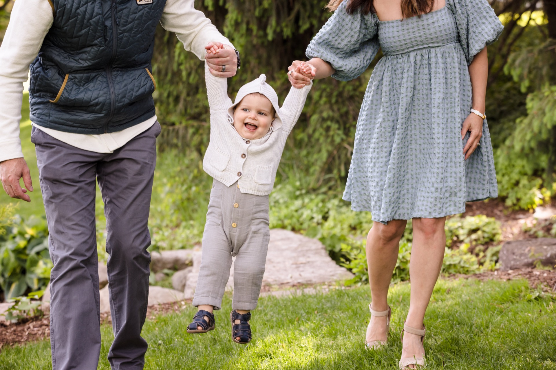 Parents swinging toddler family photos Michigan
