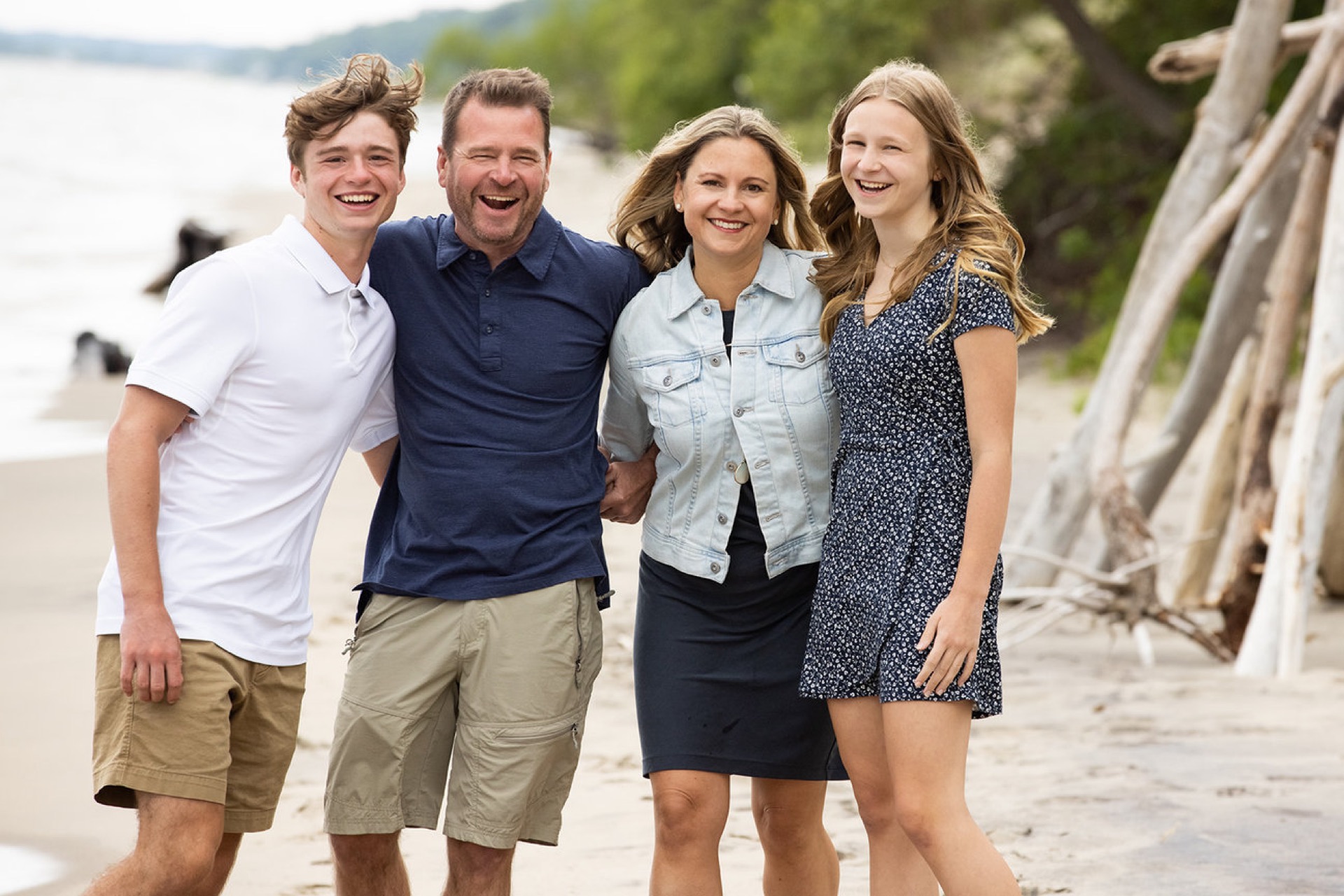 Family portraits laughing at the beach West Michigan