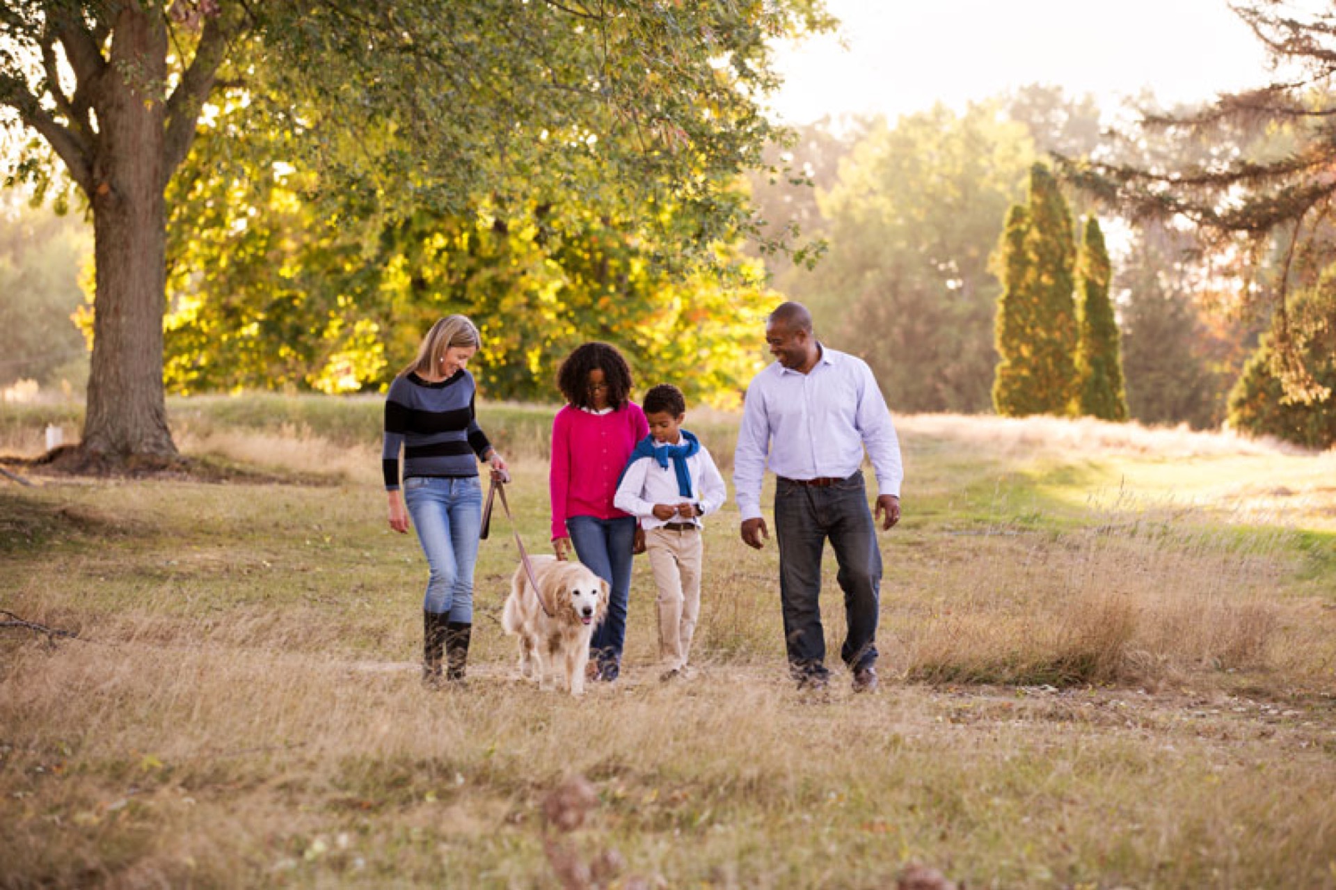 Family mini session walking with dog fall Michigan