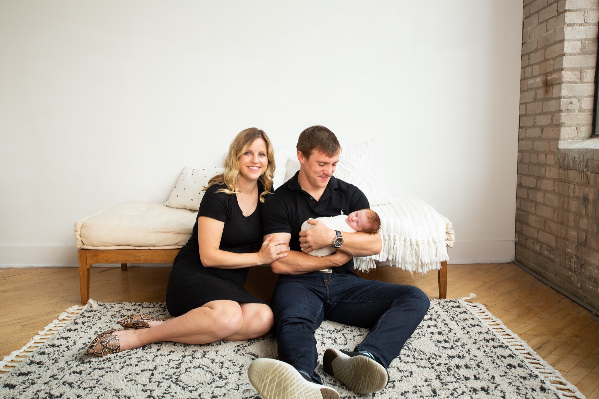 Parents with newborn studio session Grand Rapids