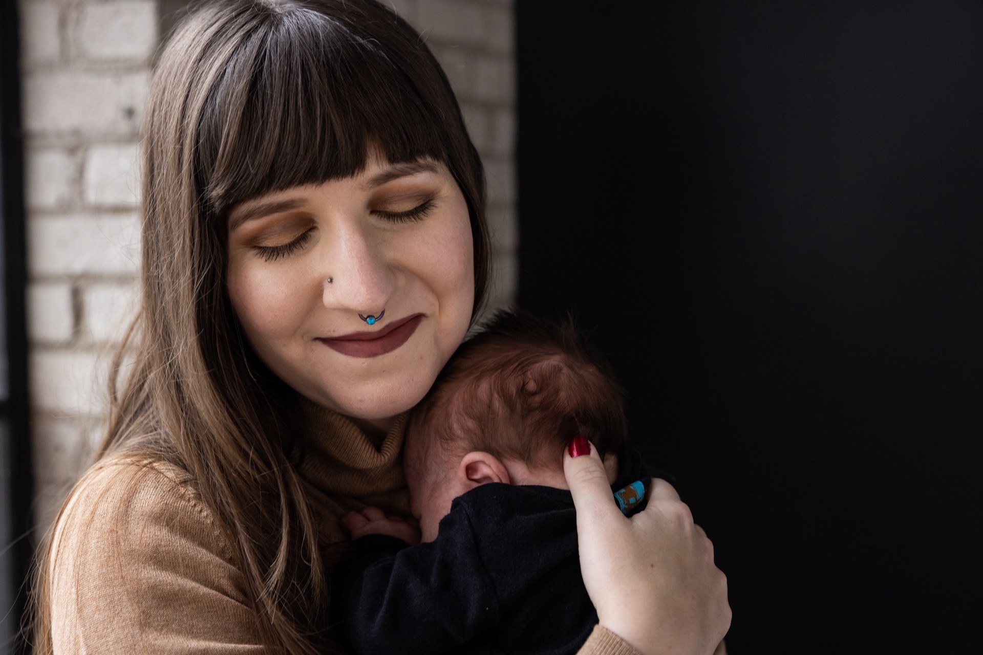 Mom holding newborn portrait West Michigan